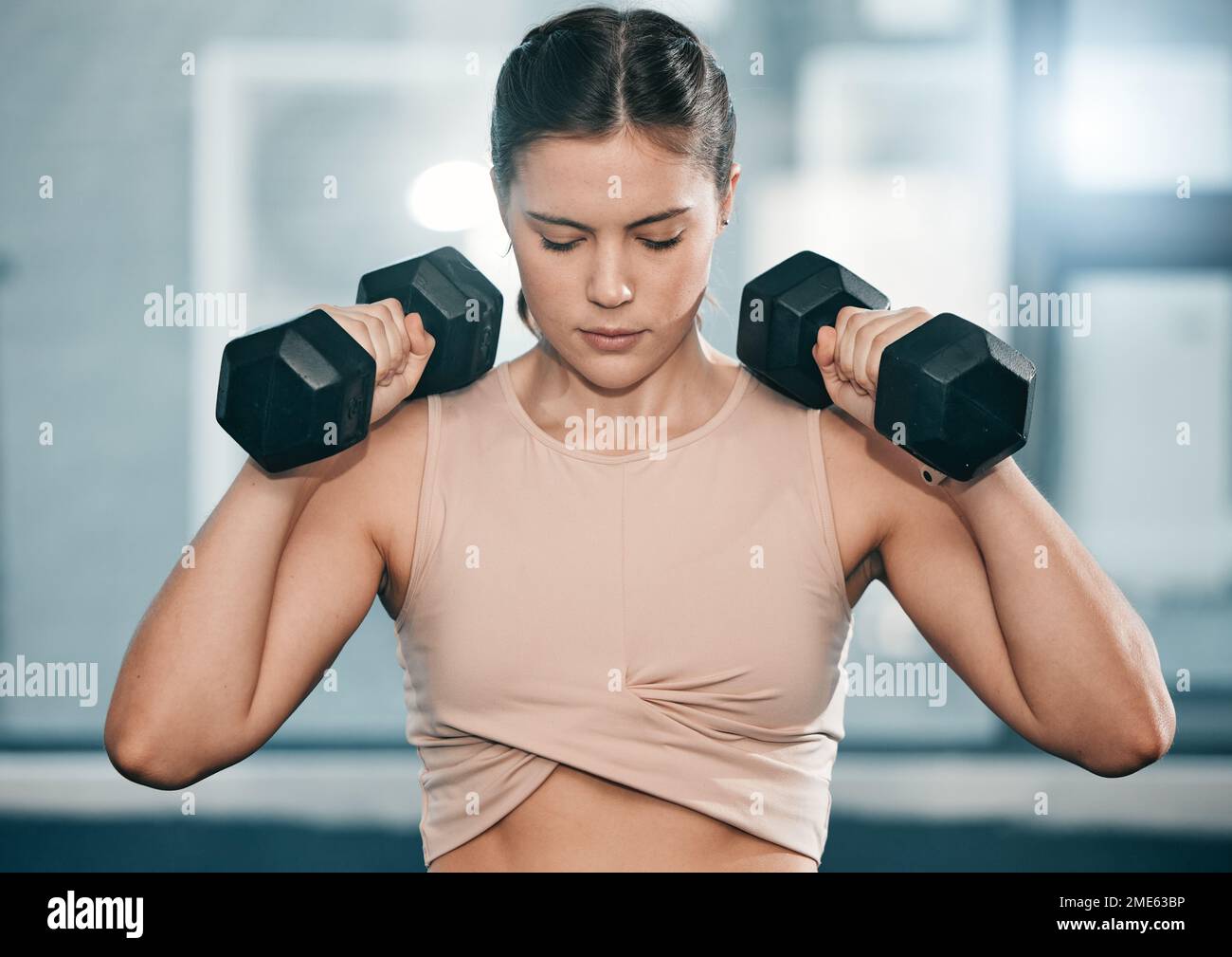 Gym dumbbell exercise and woman doing muscle fitness performance for body health strength training or bodybuilding. Strong arm workout athlete Stock Photo Alamy