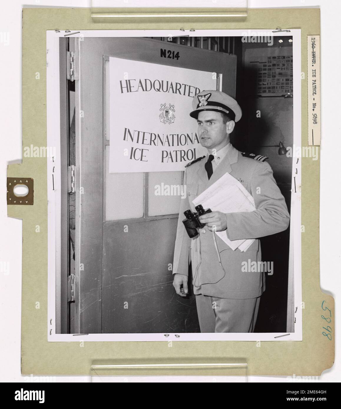 International Ice Patrol 1960. Lieut. Commander Robertson P. Dinsmore, U.S. Coast Guard, of Falmouth Mass., Executive Officer for Commander, International Ice Patrol of 1960, departing Ice Patrol Headquarters at Argentia, Newfoundland, on ice observation flight. Stock Photo