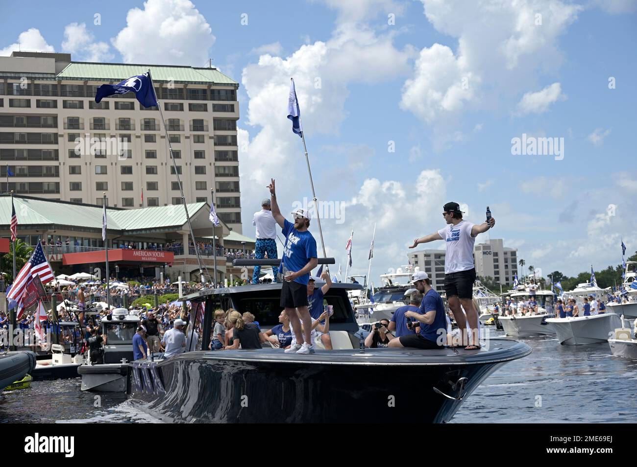 Tampa Bay Lightning defenseman Luke Schenn watches his son, Kingston, as  defenseman Victor Hedman, left, and center Steven Stamkos, rear right,  stand behind him during the NHL hockey Stanley Cup champions' Boat