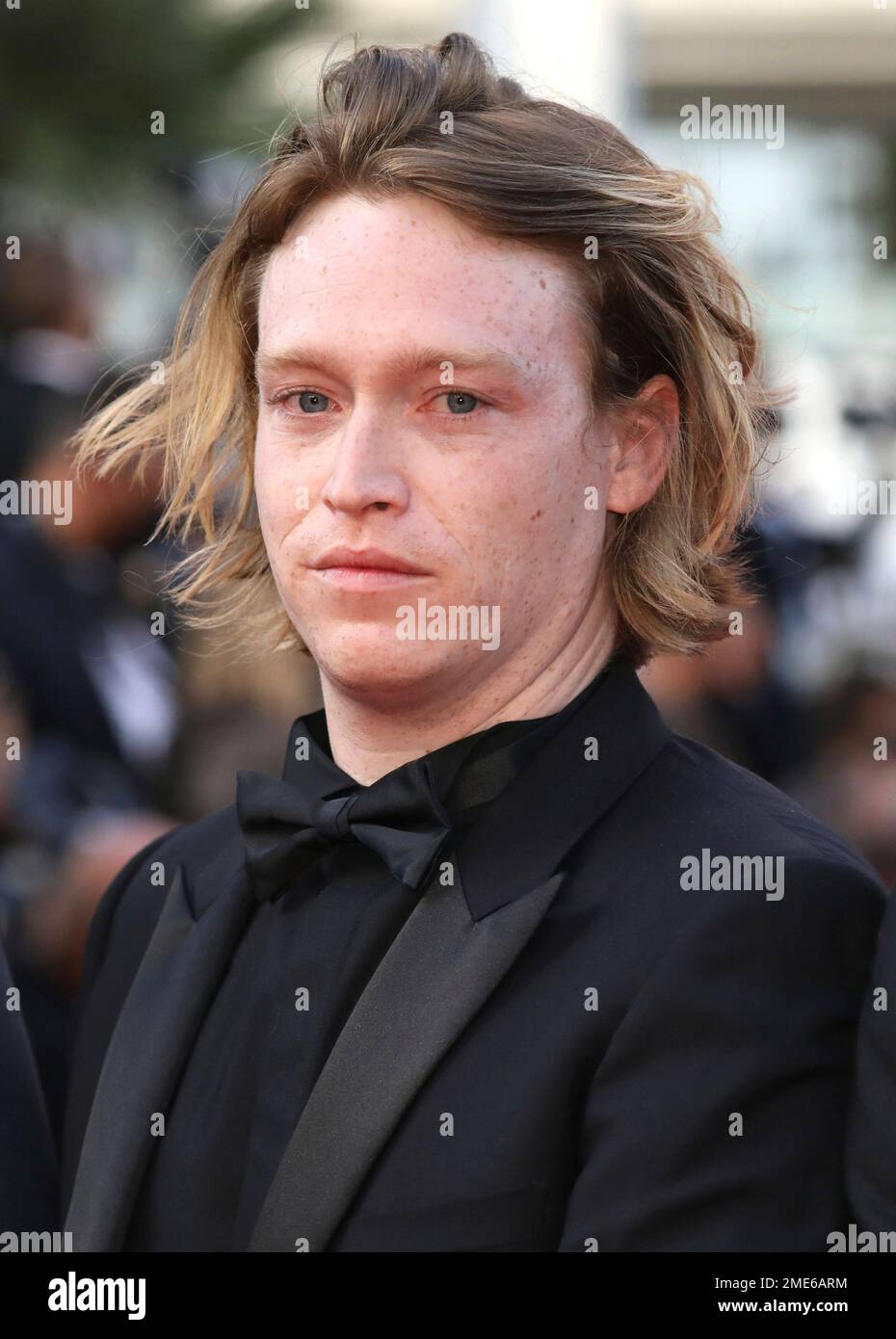 Caleb Landry Jones poses for photographers upon arrival at the awards