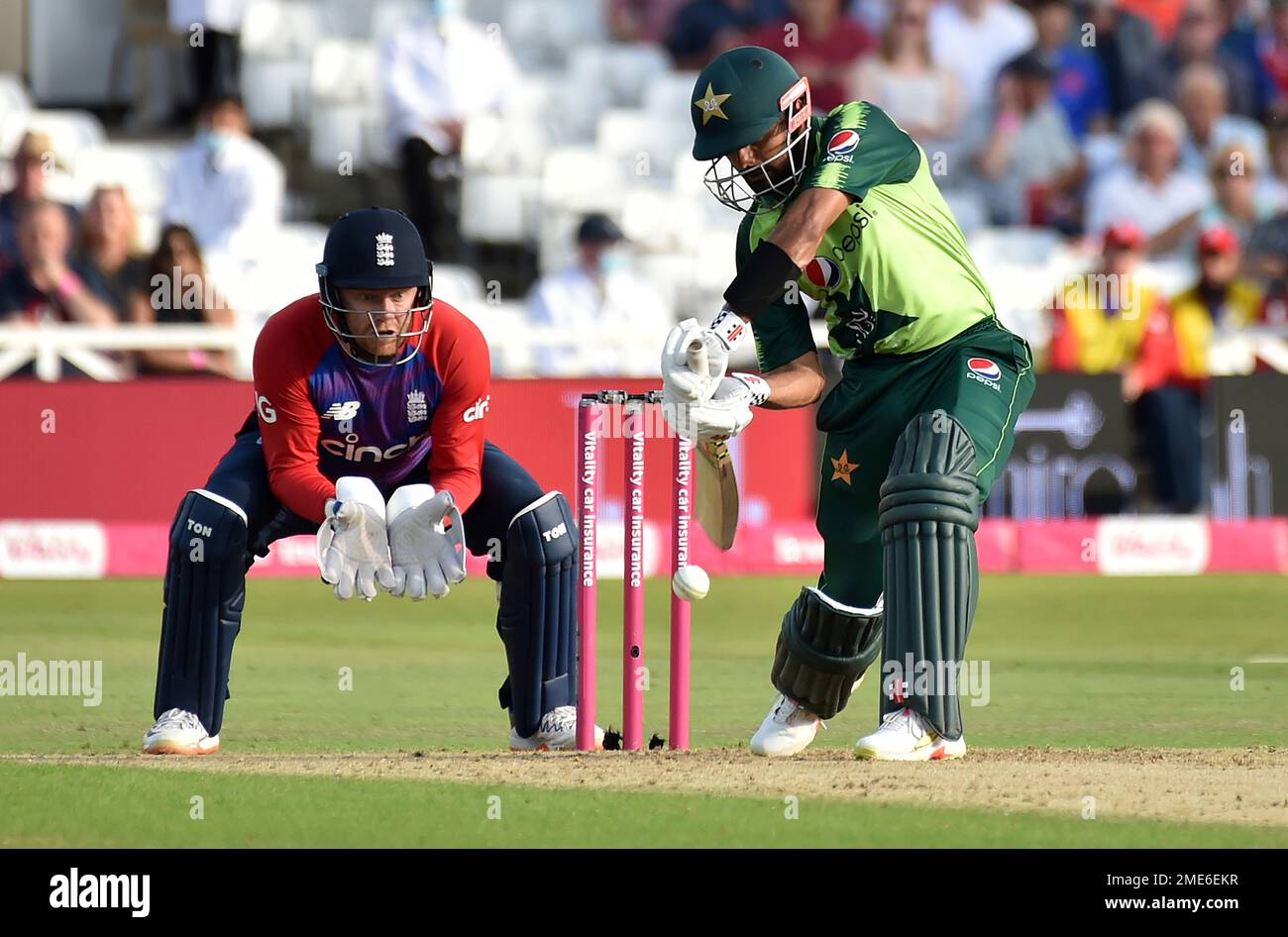 Pakistan's Captain Babar Azam, Right, Plays A Shot During The First ...