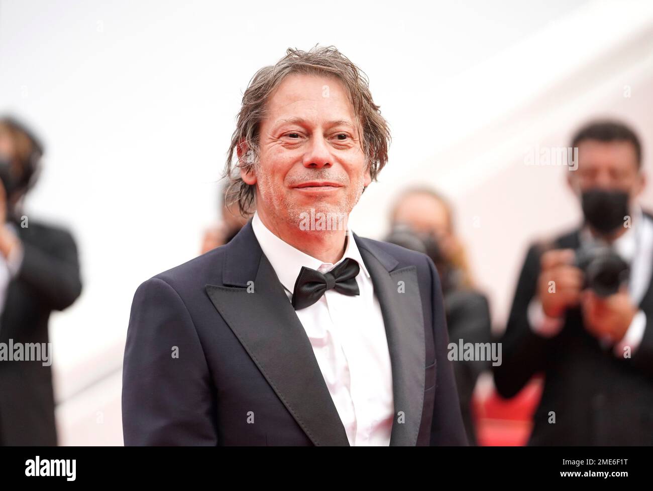 Mathieu Amalric poses for photographers upon arrival at the premiere of