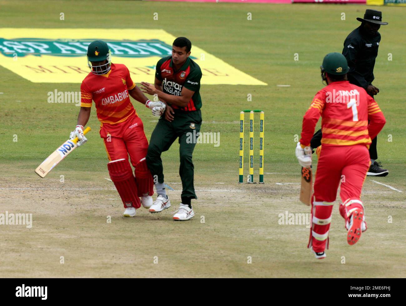 Zimbabwe batsman Regis Chakabva, left, runs into Bangladesh bowler