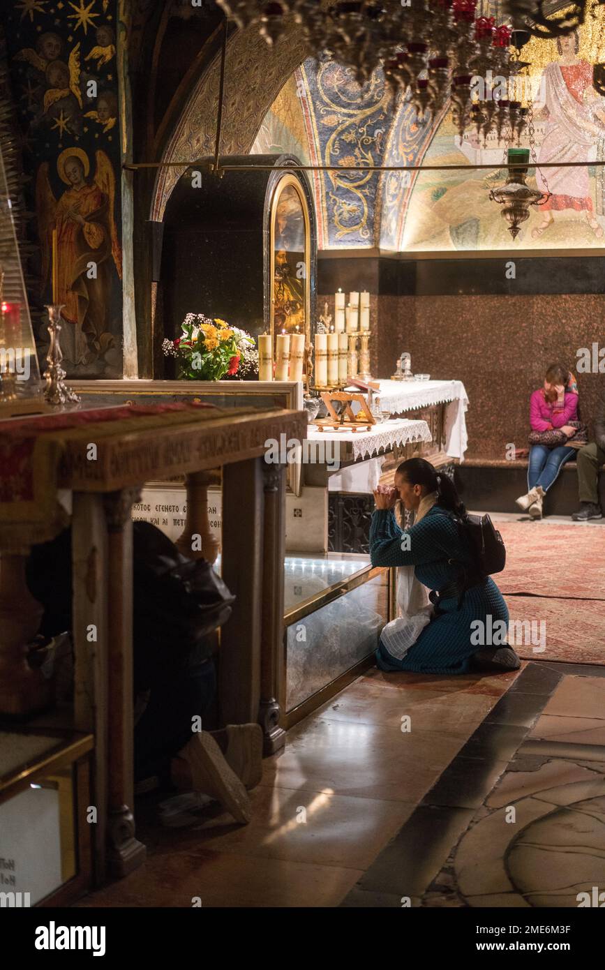 Pilgrims and tourists in the Church of the Holy Sepulchre in the Old Jerusalem, Israel, Middle east, Asia. Stock Photo