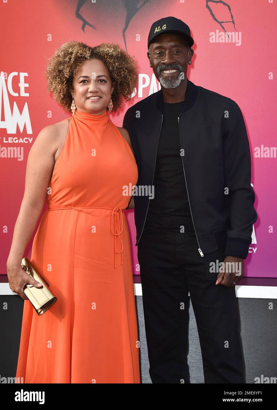 Bridgid Coulter, left, and Don Cheadle arrive at the world premiere of