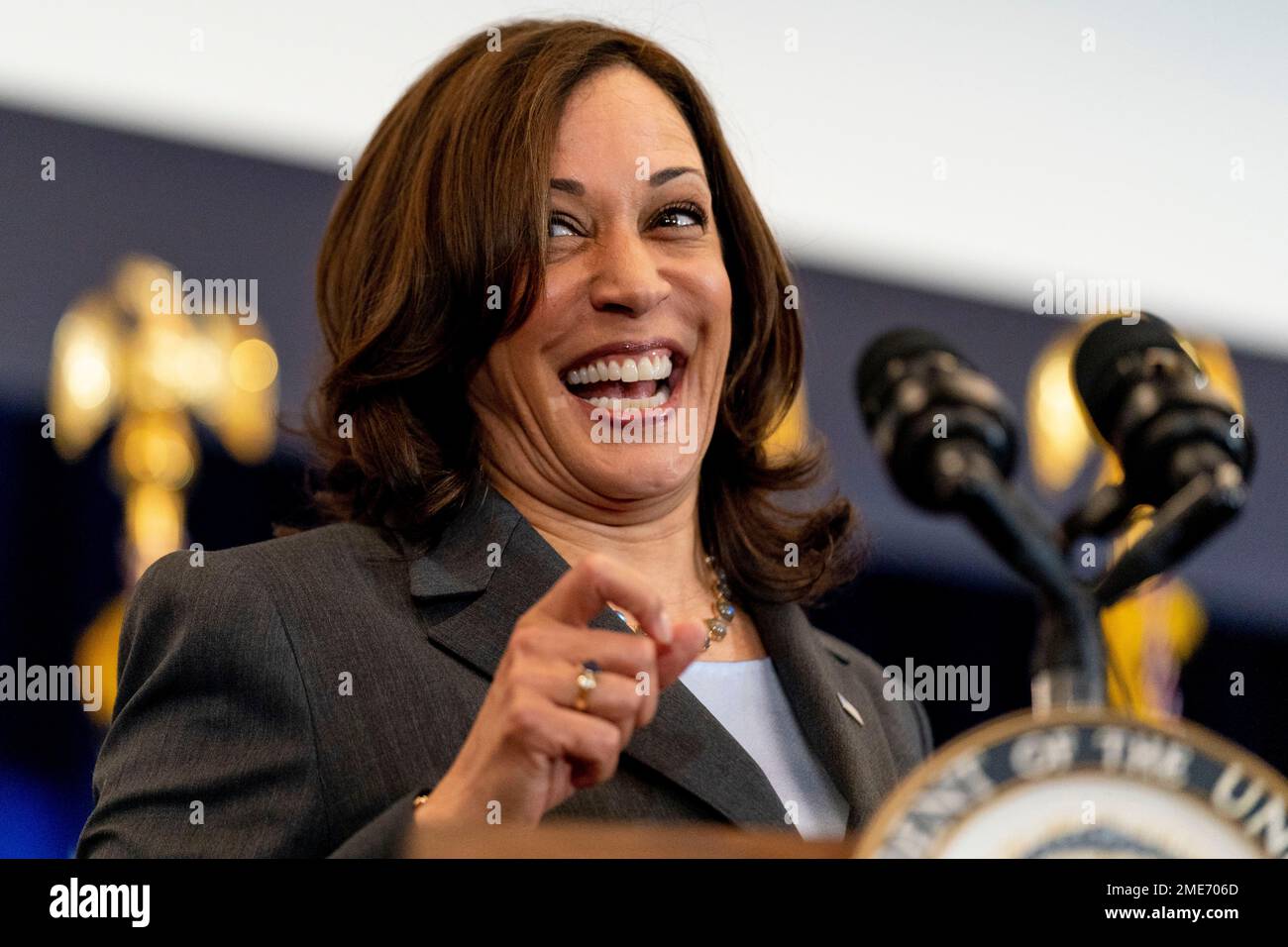 Vice President Kamala Harris smiles to a person who shouted out as she