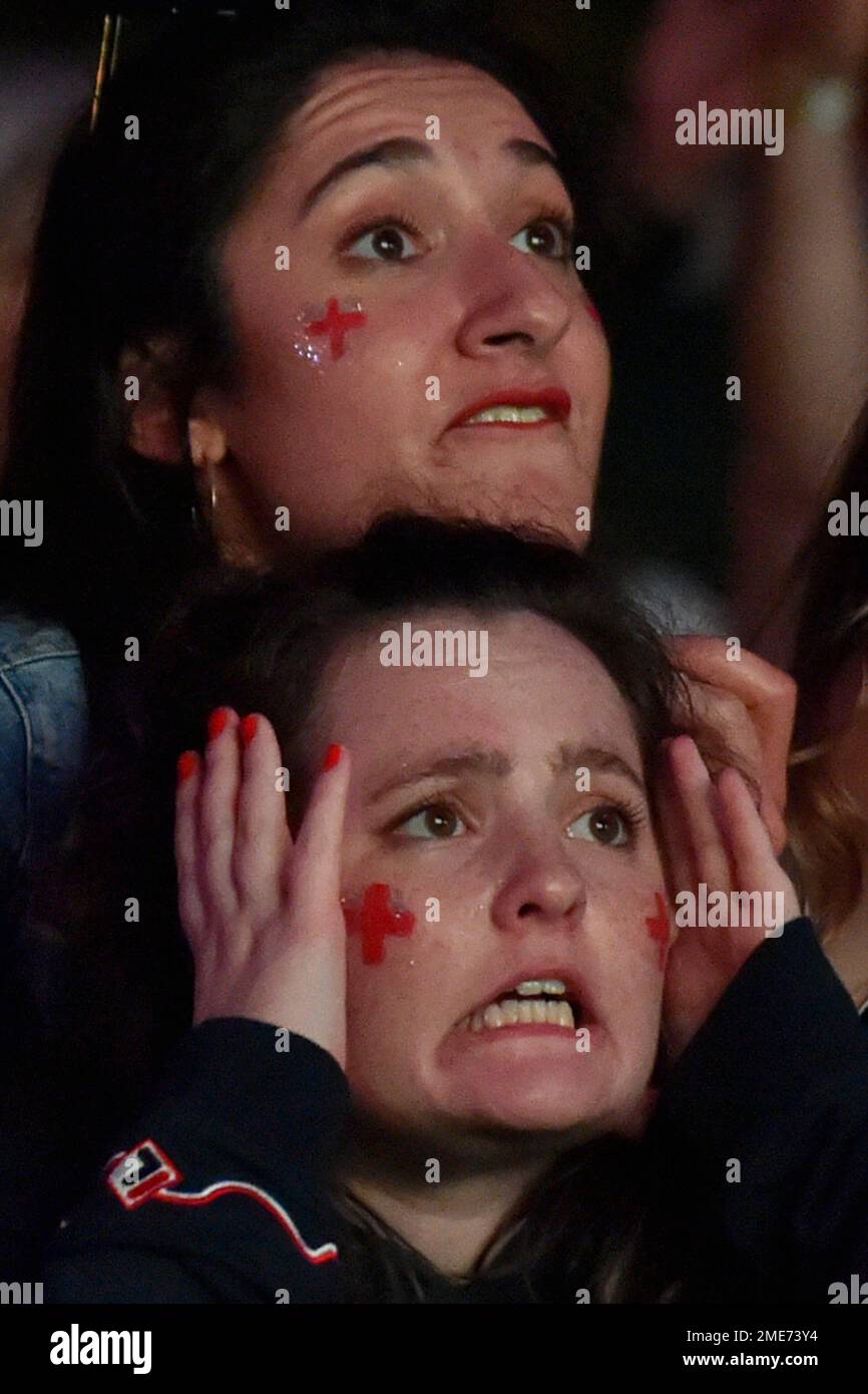 English supporters react watching the game during extra times at a fan zone in Manchester