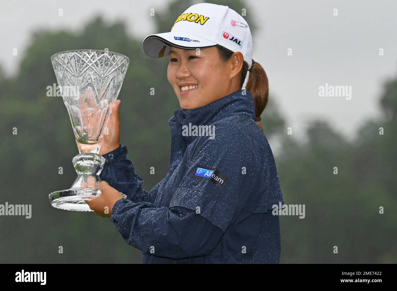 Nasa Hataoka, of Japan, holds the championship trophy after winning the