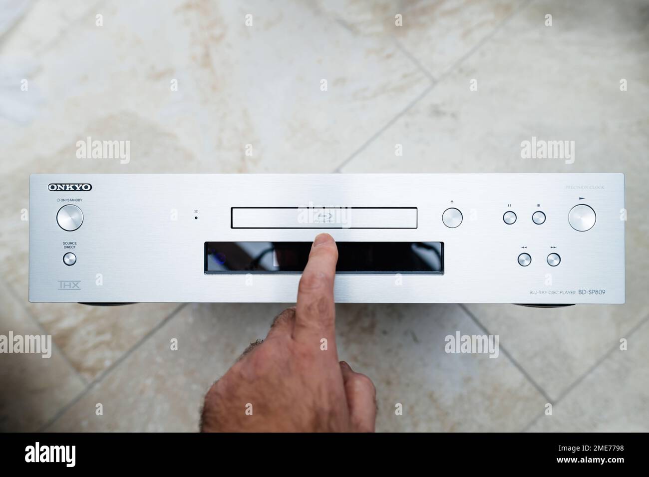 Paris, France - Oct 18, 2023: POV male hand pointing to new Onkyo BD-SP809  top-of-the-range Blu-ray deck with Menu text on dot matrix display Stock  Photo - Alamy