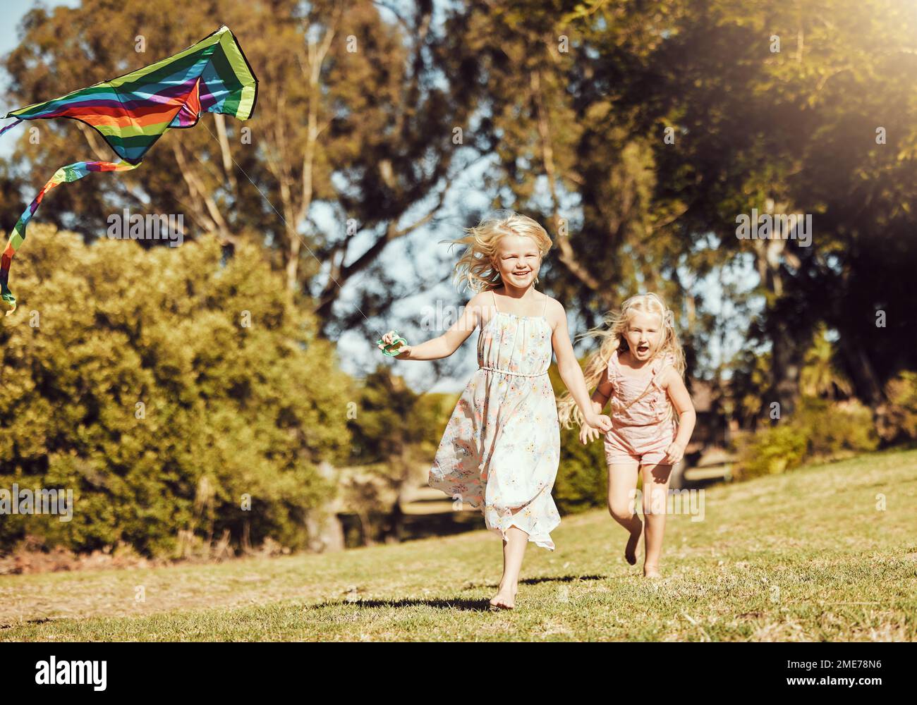Kite, running and children running in an outdoor park with summer fun