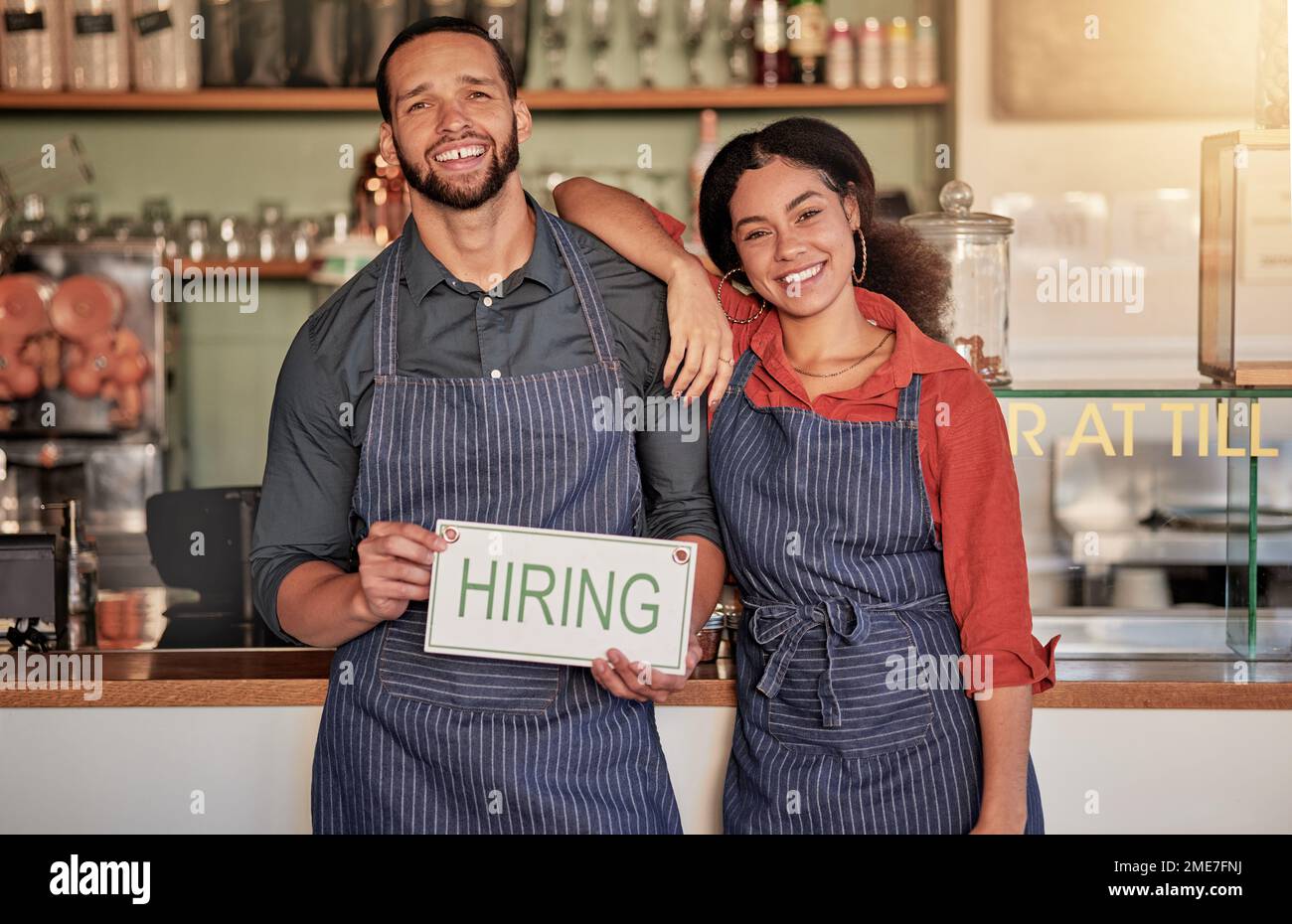 Small business, portrait or couple with a hiring sign for job 