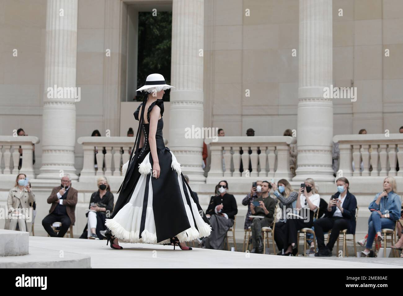 A model wears a creation for Chanel's Haute Couture Fall-Winter 2021-2022  fashion collection presented at the Palais Galliera which hosts the museum  of fashion and fashion history, Tuesday, July 6, 2021 in