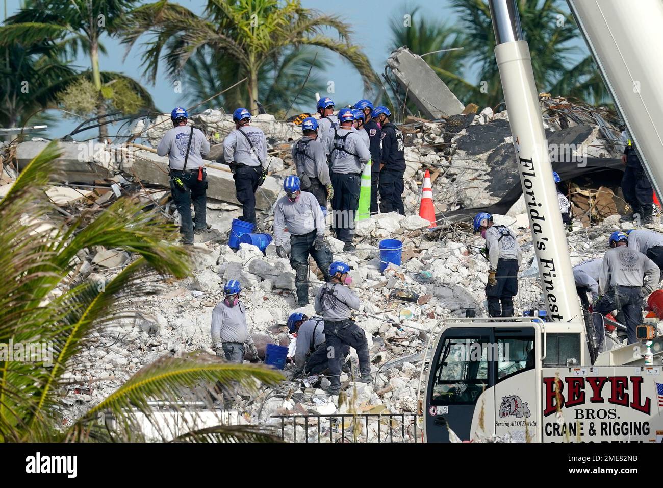 Rescue crews work at the site of the collapsed Champlain Towers South ...