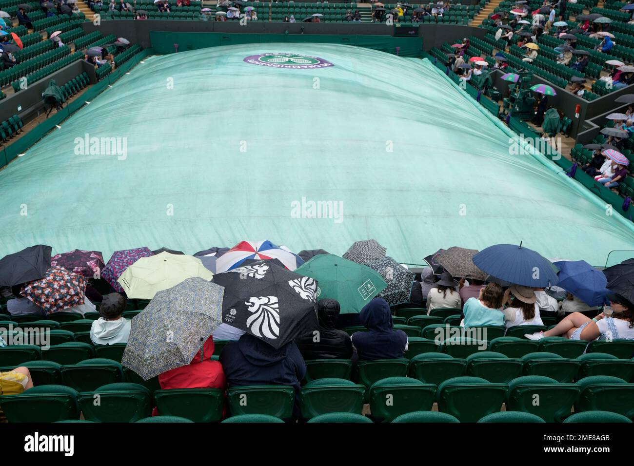 Covers are pulled over Court 2 during a rain delay on day six of the Wimbledon Tennis