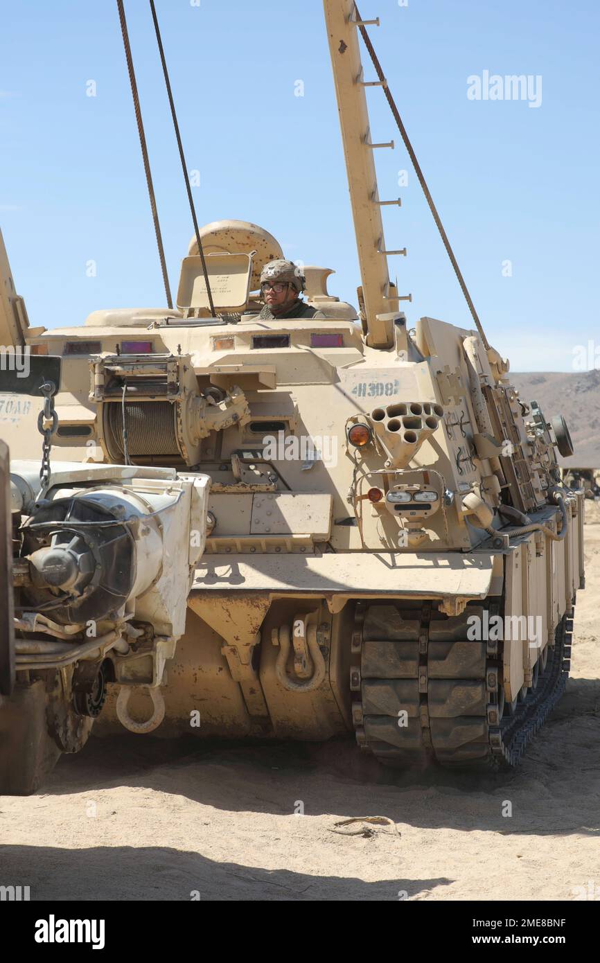 A U.S. Soldier assigned to 2nd Battalion, 70th Armored Regiment, 2nd Armored Brigade Combat Team, 1st Infantry Division uses a M88 Hercules Recovery Vehicle during Decisive Action Rotation 22-09 at the National Training Center, Fort Irwin, Calif., Aug. 14, 2022. Stock Photo