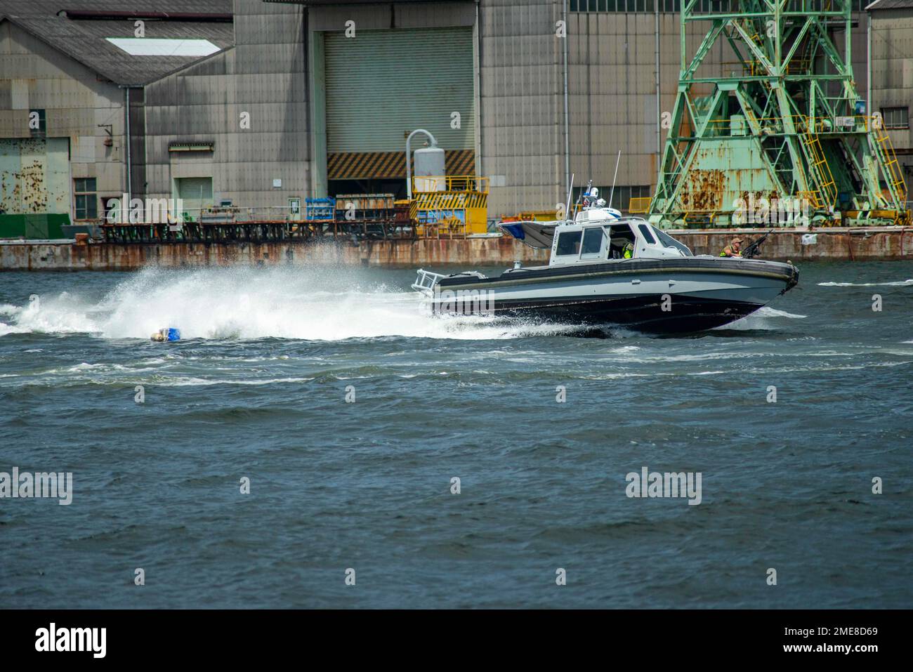 Sailors assigned to Commander, Fleet Activities Sasebo (CFAS) execute high speed boat maneuvers to disperse a simulated crashed unmanned aerial system (UAS) as part of an anti-terrorism training drill during Exercise Citadel Pacific 2022 (CP22) at CFAS Aug. 15, 2022. CP22 is an annual exercise that is not in response to any specific real world threat but is used to evaluate the readiness of fleet and installation security programs. Stock Photo