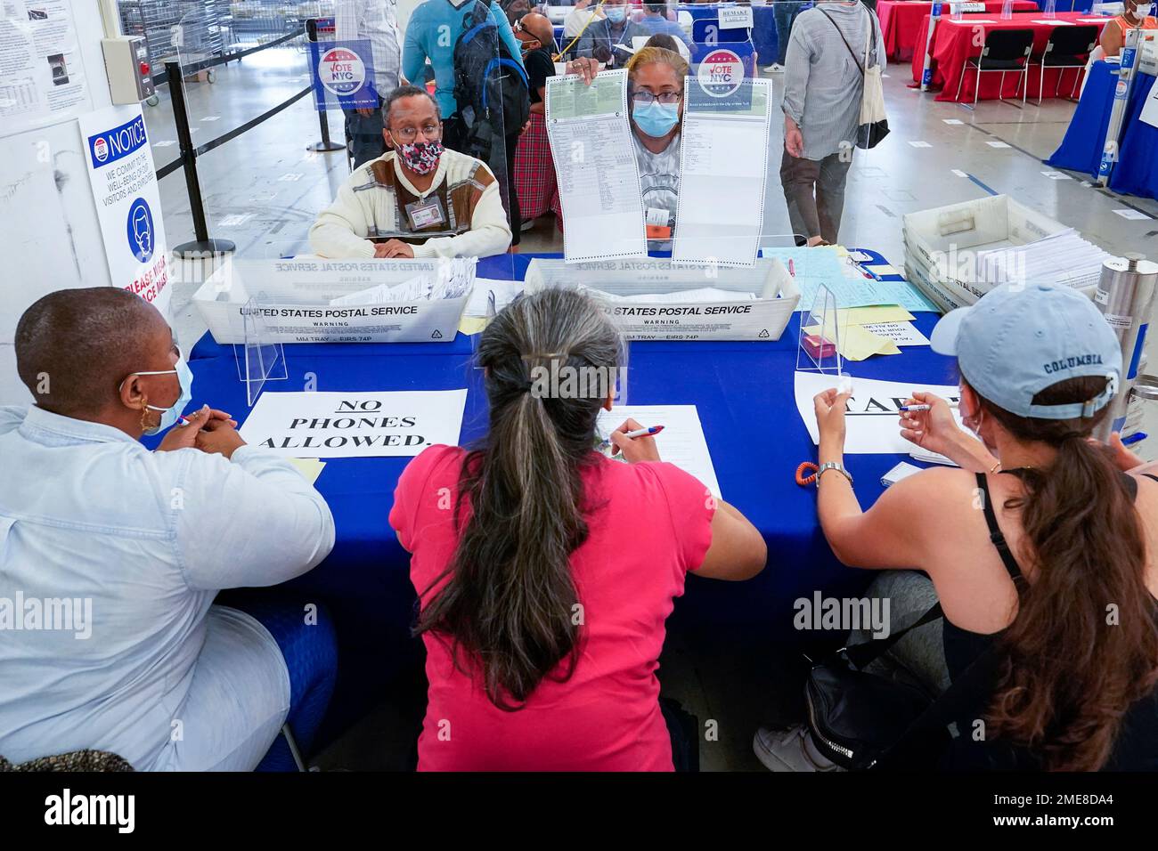New York City Board of Election staff members, background, show a