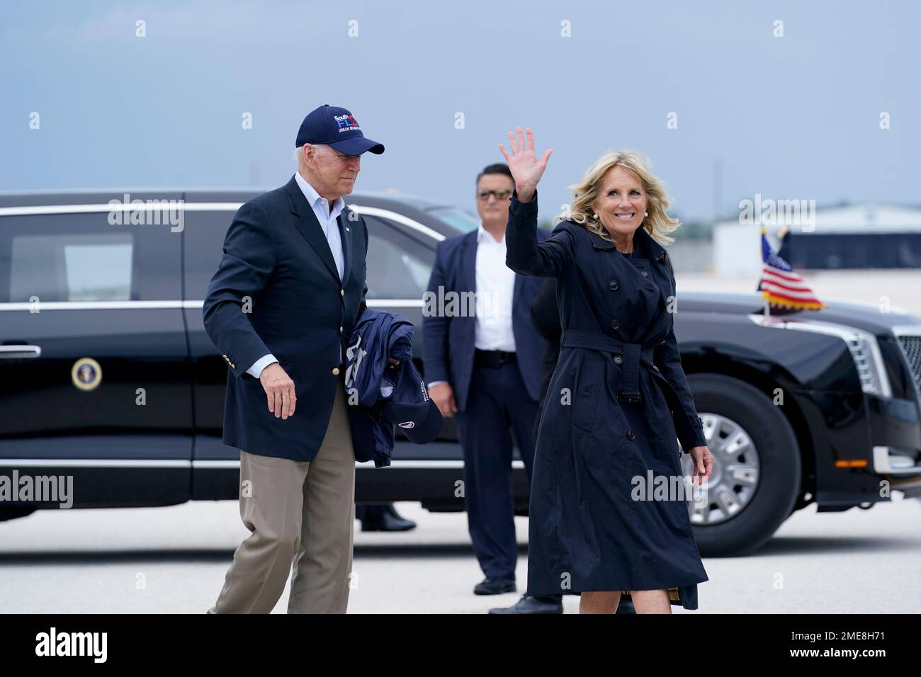 President Joe Biden and first lady Jill Biden walk to board Air Force