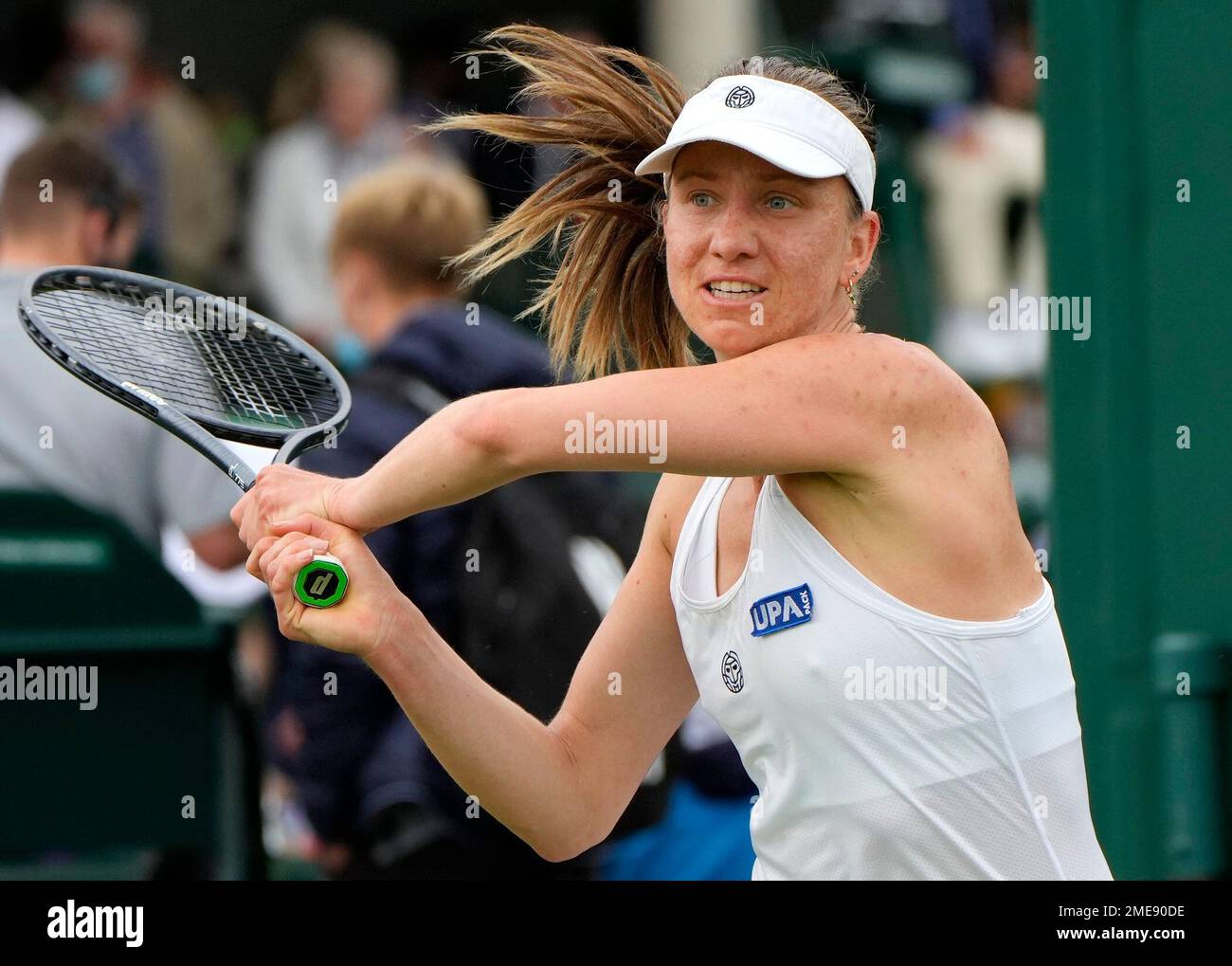 Germany's Mona Barthel plays a return to China's Lin Zhu during the women's  singles first round match on day two of the Wimbledon Tennis Championships  in London, Tuesday June 29, 2021. (AP