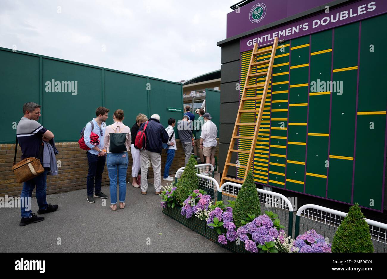 People queue to spectate on Court 17 on day two of the Wimbledon Tennis ...