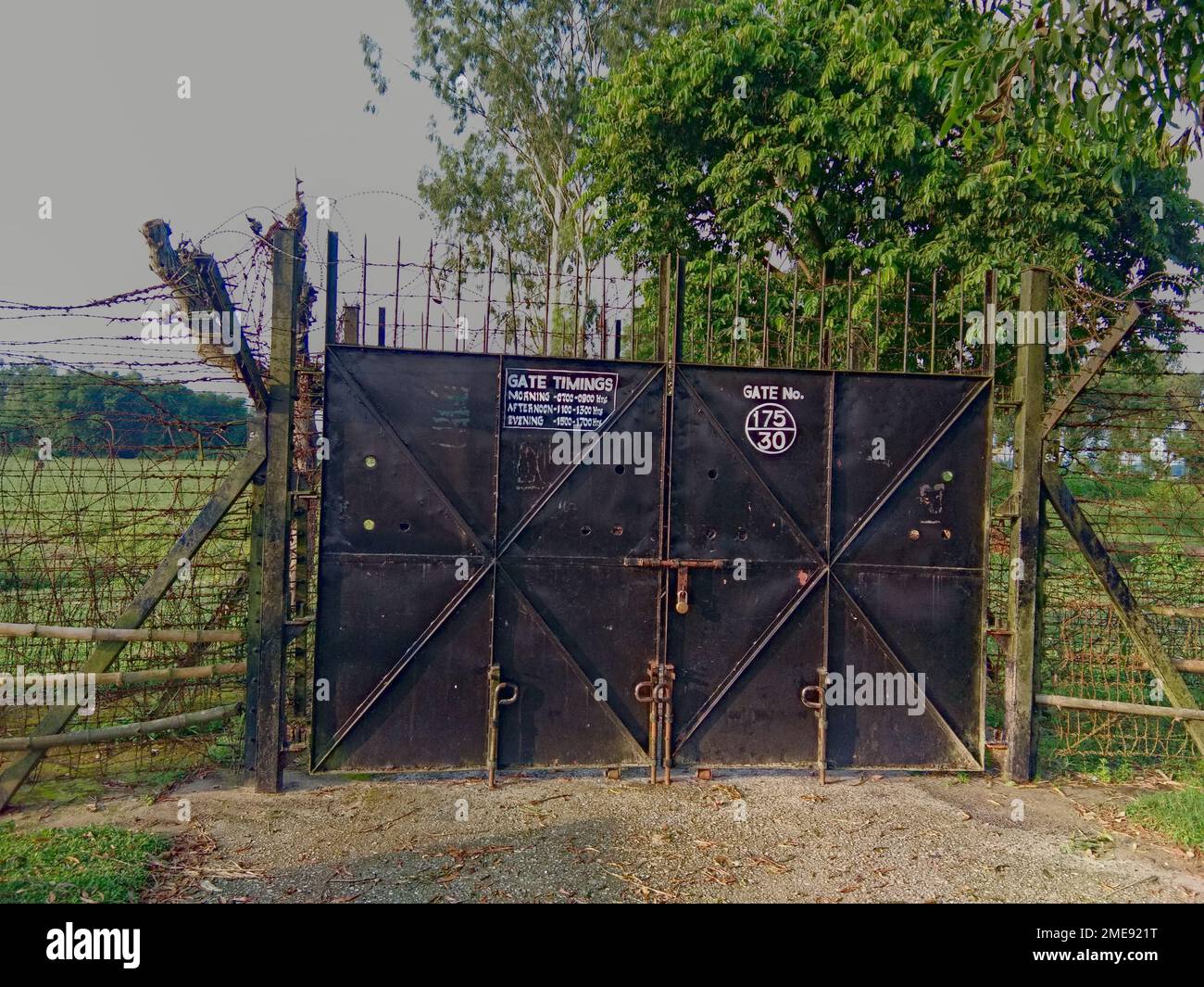 09.08.2021 raiganj west bengal india, border gate and fence between india and bangladesh country Stock Photo