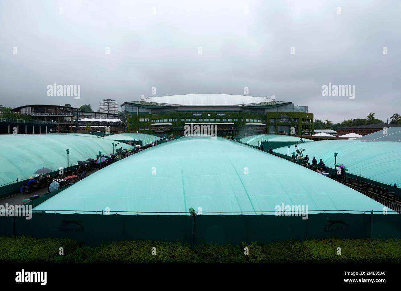 The outside courts are covered during a rain delay on day one of the Wimbledon Tennis