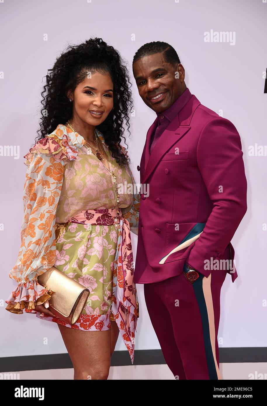 Kirk Franklin, right, and Tammy Collins arrive at the BET Awards on