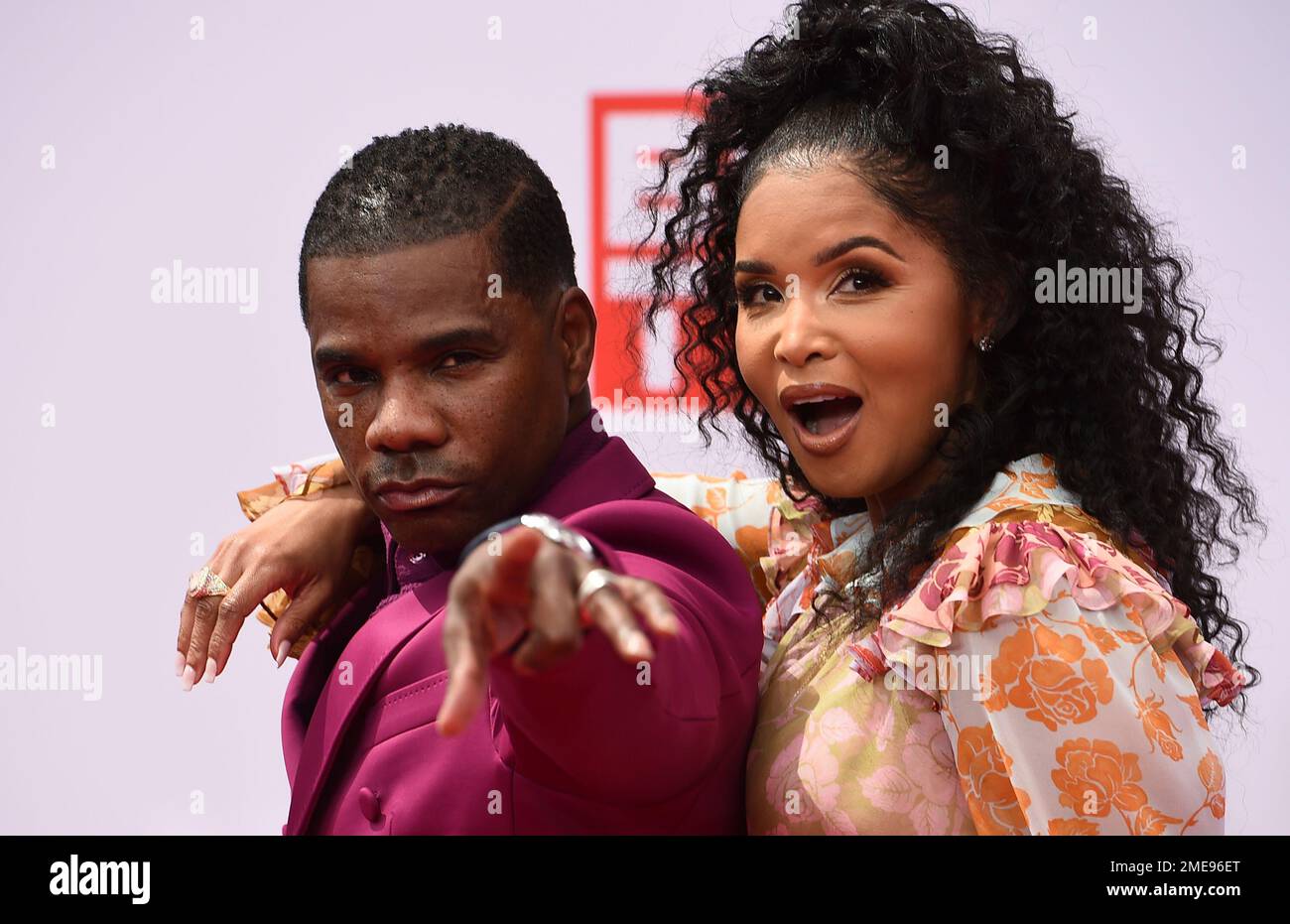Kirk Franklin, left, and Tammy Collins arrive at the BET Awards on