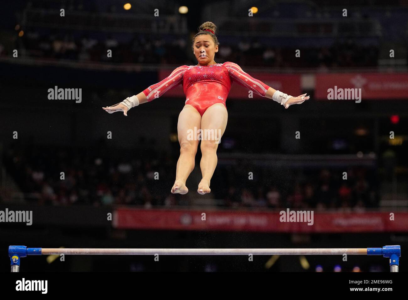 Suni Lee competes on the uneven bars during the women's U.S. Olympic Gymnastics Trials Sunday