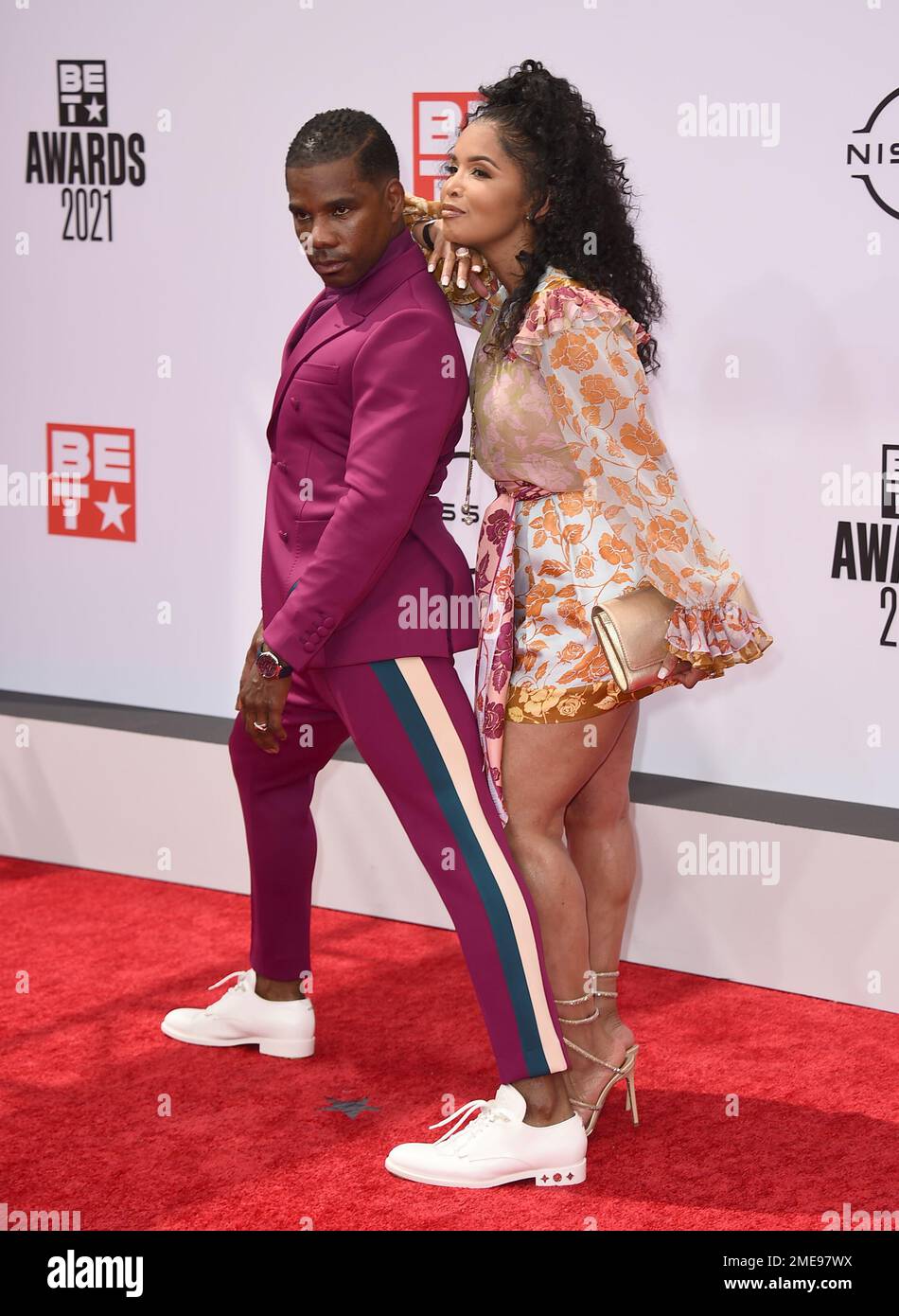 Kirk Franklin, left, and Tammy Collins arrive at the BET Awards on