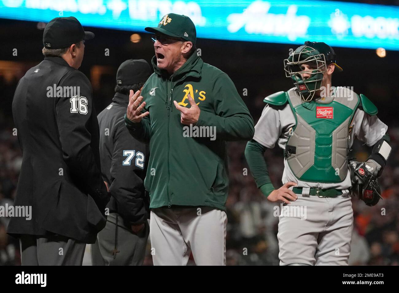 Oakland Athletics manager Bob Melvin, middle, reacts after being