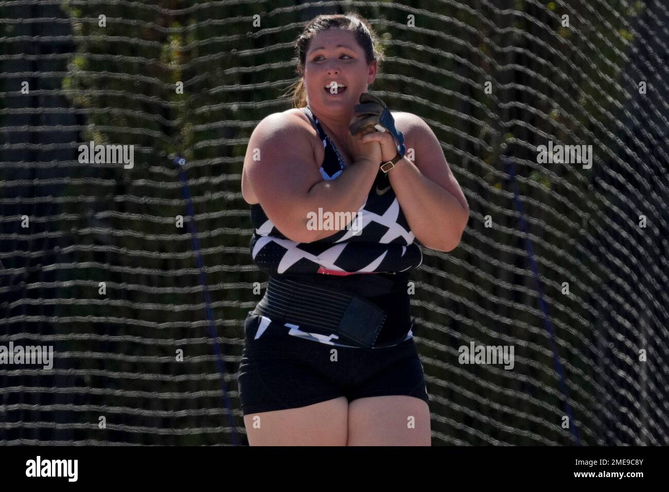 Deanna Price reacts after setting a new American record during the finals of the women's hammer