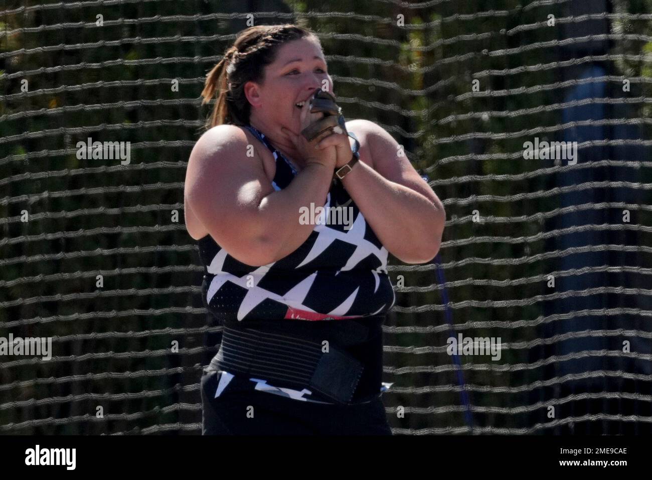 Deanna Price reacts after setting a new American record during the finals of the women's hammer
