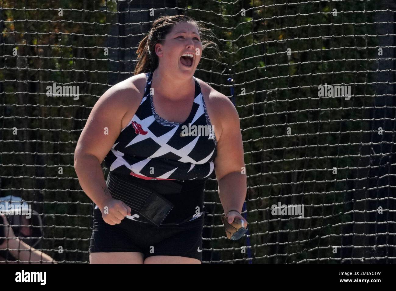 Deanna Price reacts after setting a new American record during the finals of the women's hammer
