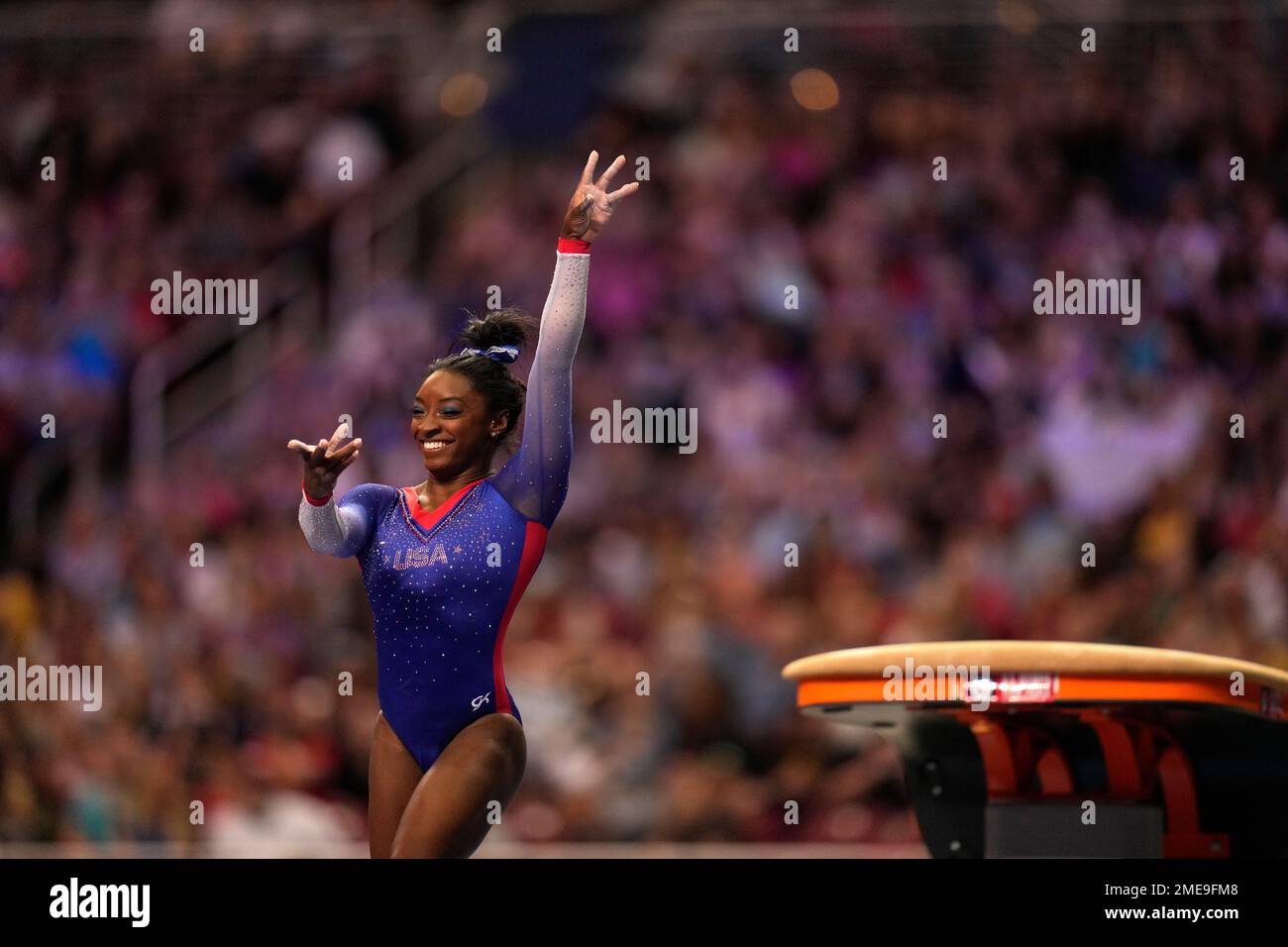 Simone Biles smiles after competing on the vault during the women's U.S ...