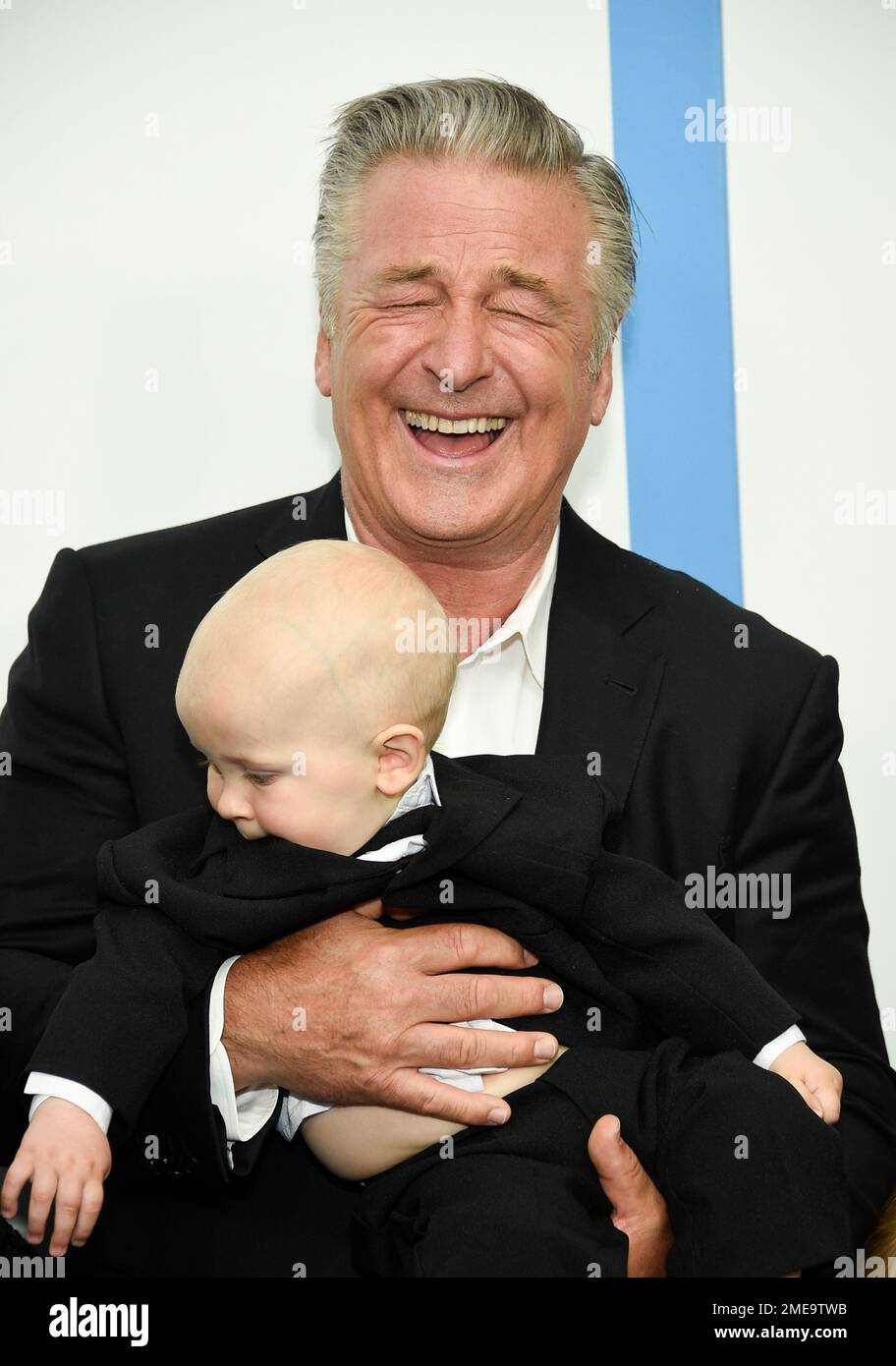 Actor Alec Baldwin holding his son Eduardo at the world premiere of