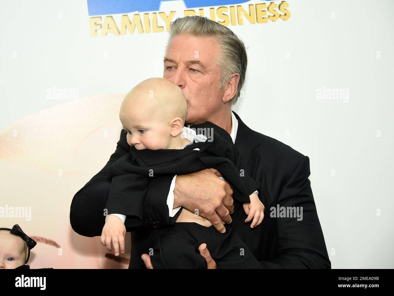 Actor Alec Baldwin holding his son Eduardo at the world premiere of
