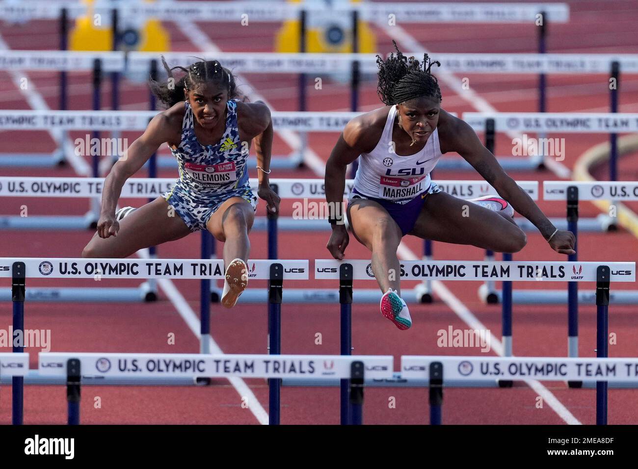 Tonea Marshall, right, wins the the first semifinal in the women's 100