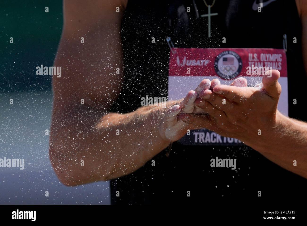 Jack Flood puts chalk on his hands during the decathlon pole vault at