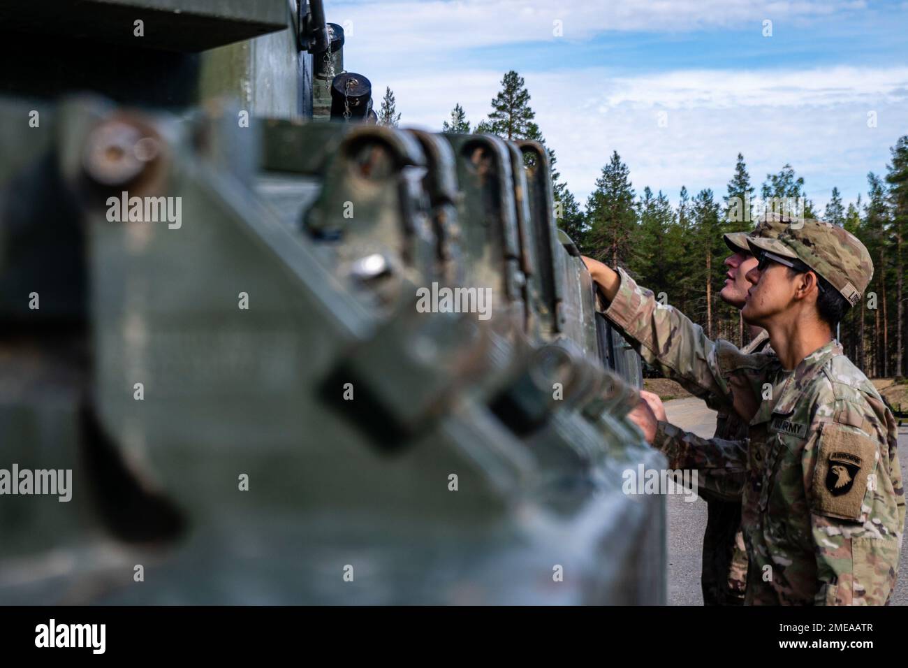 U.S. Soldiers with the 1st Battalion, 26th Infantry Regiment, 2nd Brigade Combat Team, 101st Airborne Division (Air Assault), learn about Finnish army Leopard 2 main battle tanks at Sodankyla, Finland, Aug. 15, 2022. Stock Photo