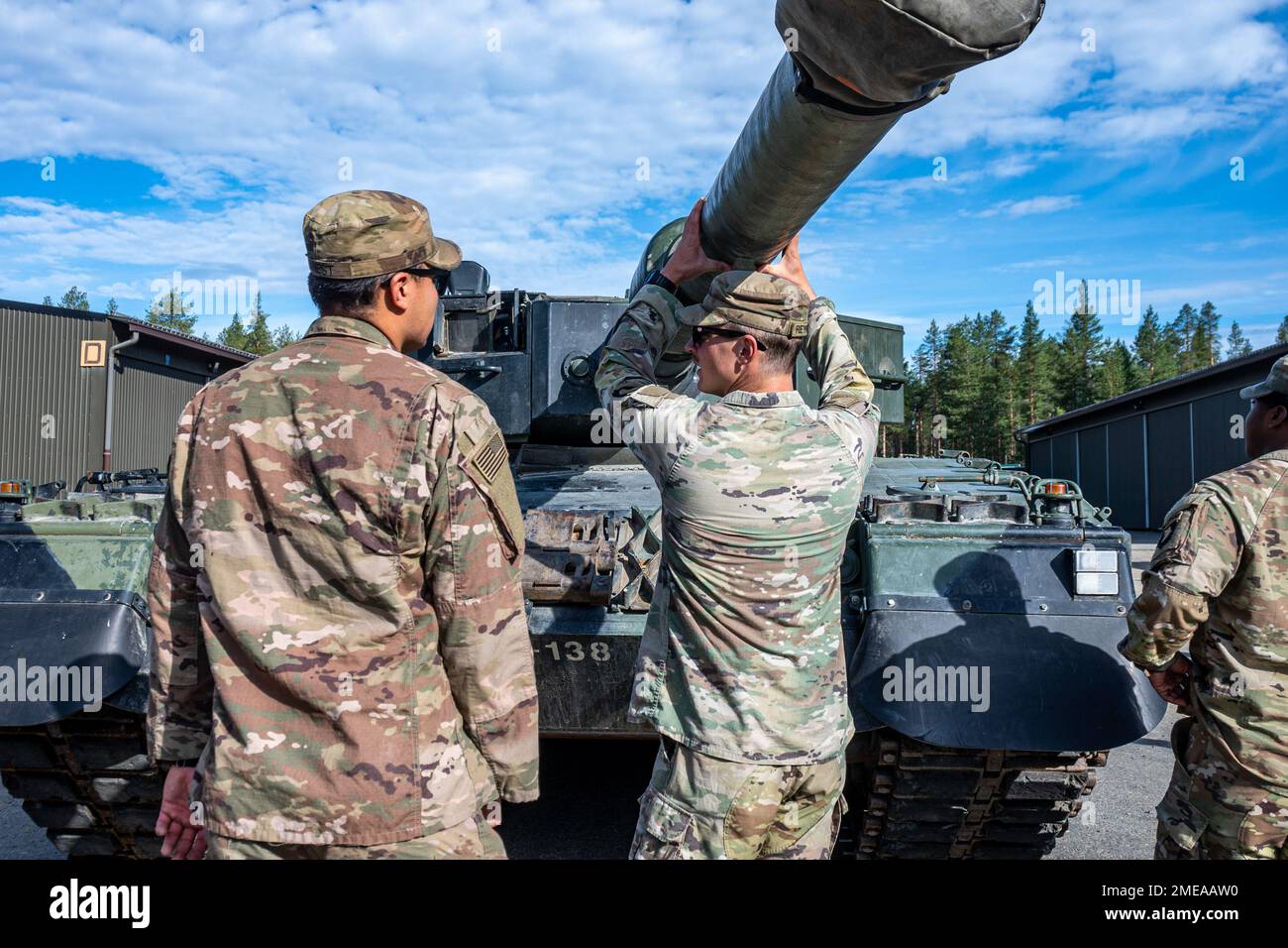 U.S. Soldiers with the 1st Battalion, 26th Infantry Regiment, 2nd Brigade Combat Team, 101st Airborne Division (Air Assault), learn about Finnish army Leopard 2 main battle tanks at Sodankyla, Finland, Aug. 15, 2022. Stock Photo