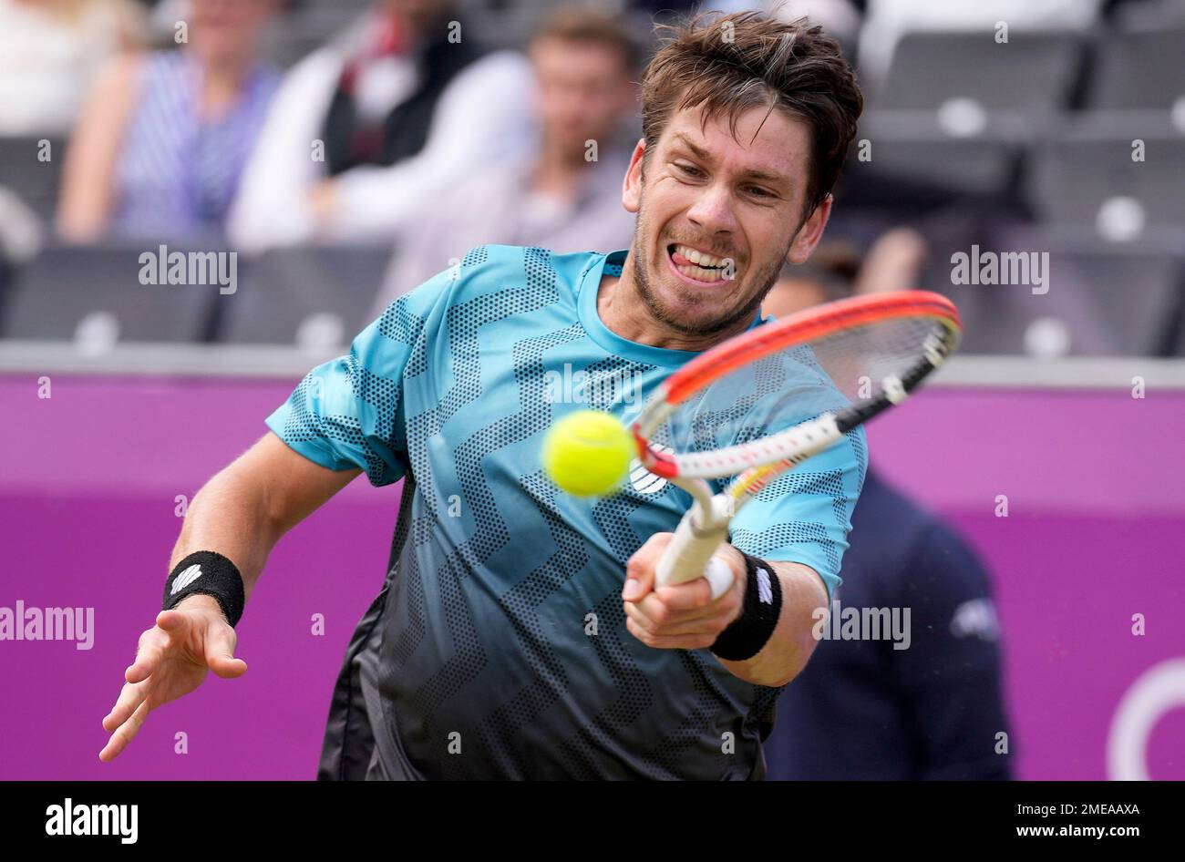 Cameron Norrie of Britain returns to Matteo Berrettini of Italy during their final singles tennis match at the Queens Club tournament in London, Sunday, June 20, 2021