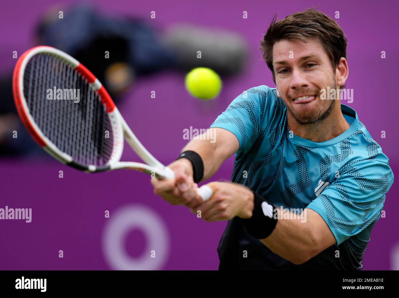 Cameron Norrie of Britain returns to Matteo Berrettini of Italy during their final singles tennis match at the Queens Club tournament in London, Sunday, June 20, 2021
