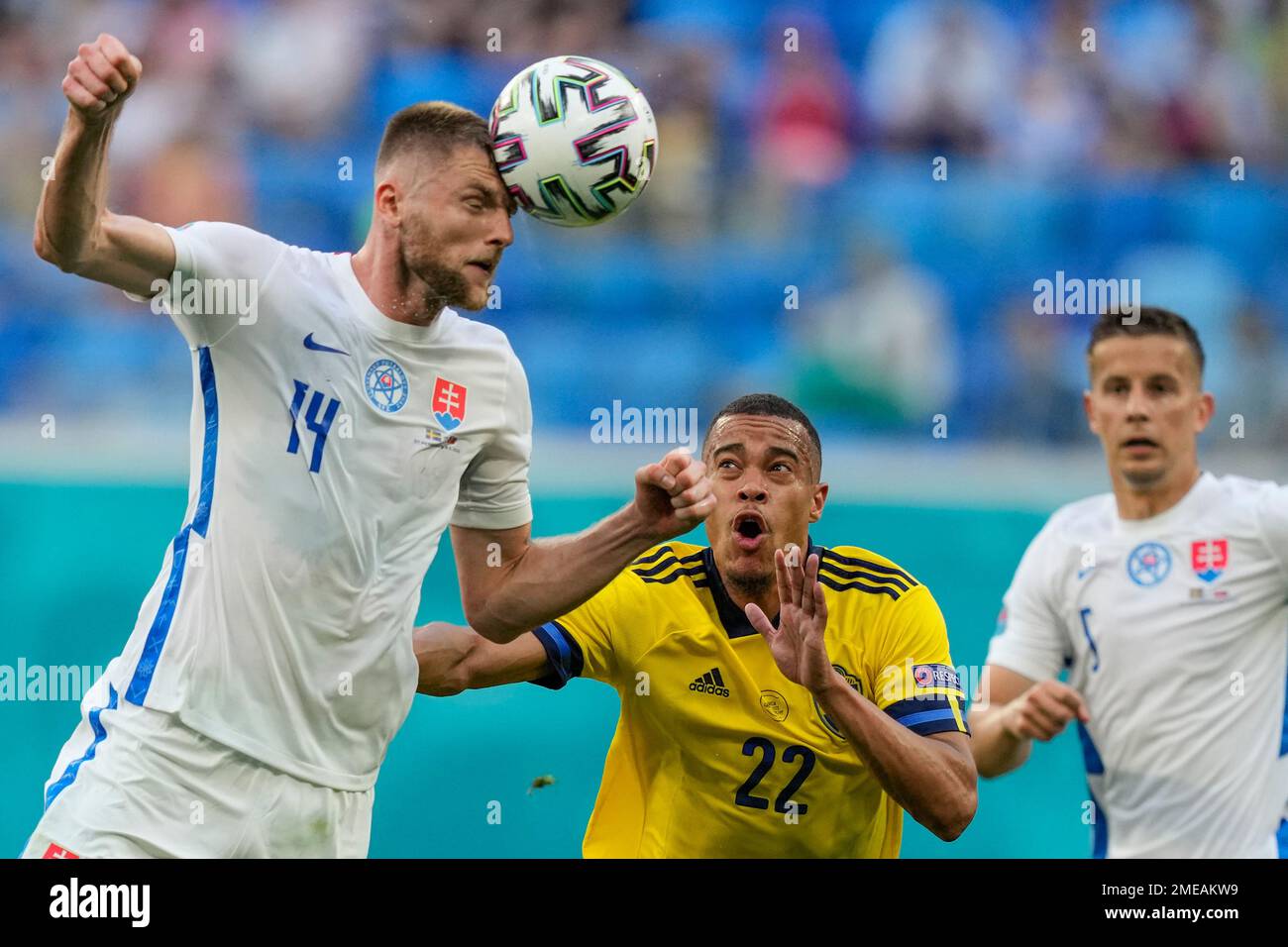 Slovakia's Milan Skriniar heads the ball as Sweden's Robin Quaison looks  on, during the Euro 2020 soccer championship group E match between Sweden  and Slovakia, at the Saint Petersburg stadium, in Saint