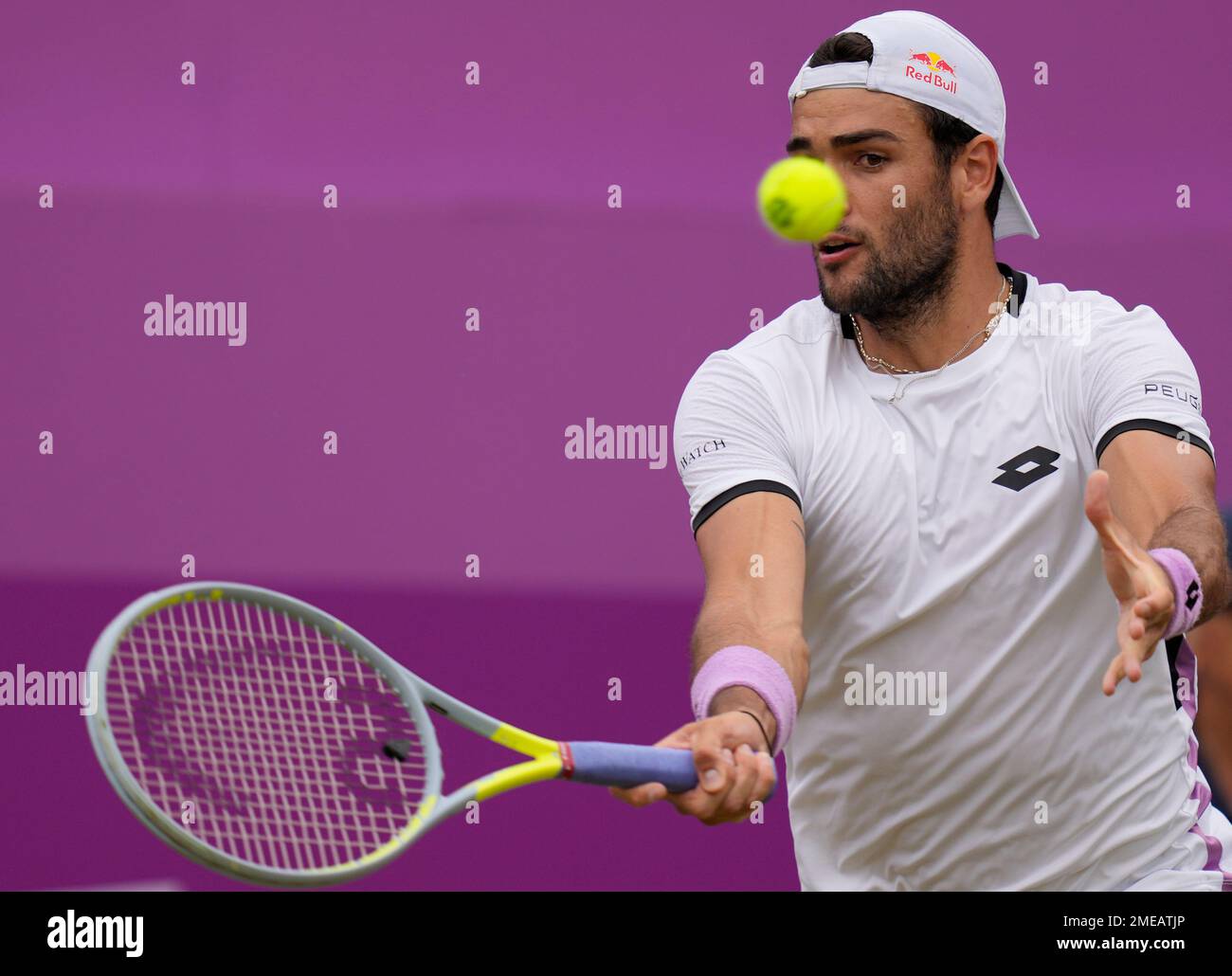 Matteo Berrettini of Italy plays a return to Andy Murray of Britain during their singles tennis match at the Queens Club tournament in London, Thursday, June 17, 2021