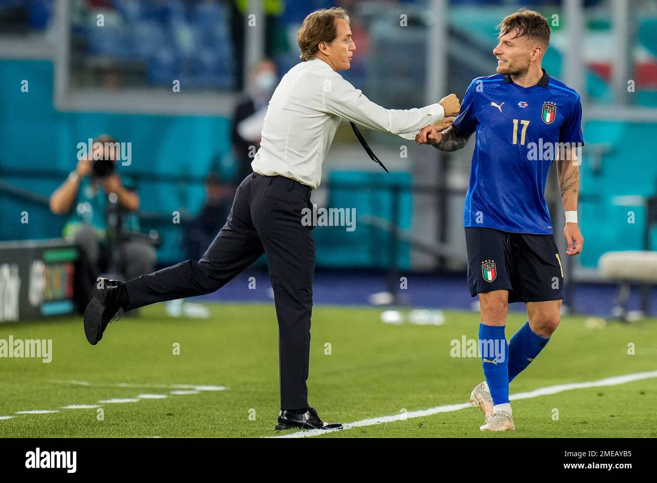 Italy s Ciro Immobile right is congratulated by Italy s manager