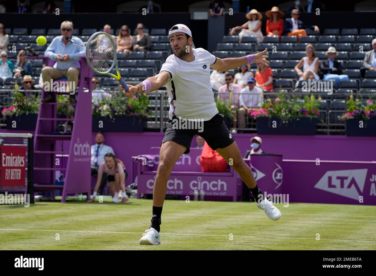 Mateo Berrettini of Italy plays a return to Stefano Travaglia of Italy  during their singles tennis match at the Queens Club tournament in London,  Tuesday, June 15, 2021. (AP Photo/Kirsty Wigglesworth Stock