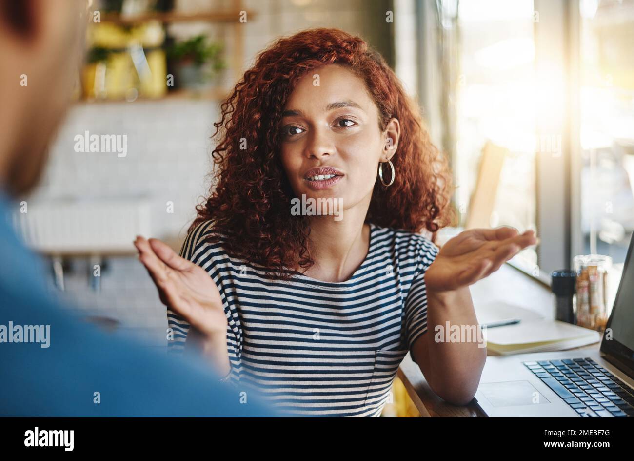 Taking their discussion to the coffee shop. two people having a