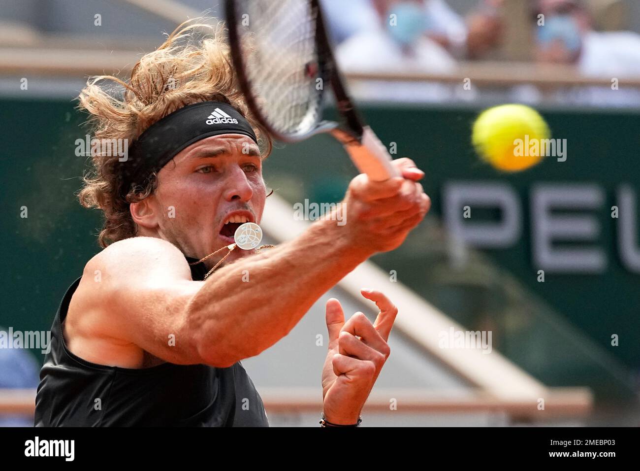 Germanys Alexander Zverev returns the ball to Stefanos Tsitsipas of Greece during their semifinal match of the French Open tennis tournament at the Roland Garros stadium Friday, June 11, 2021 in Paris