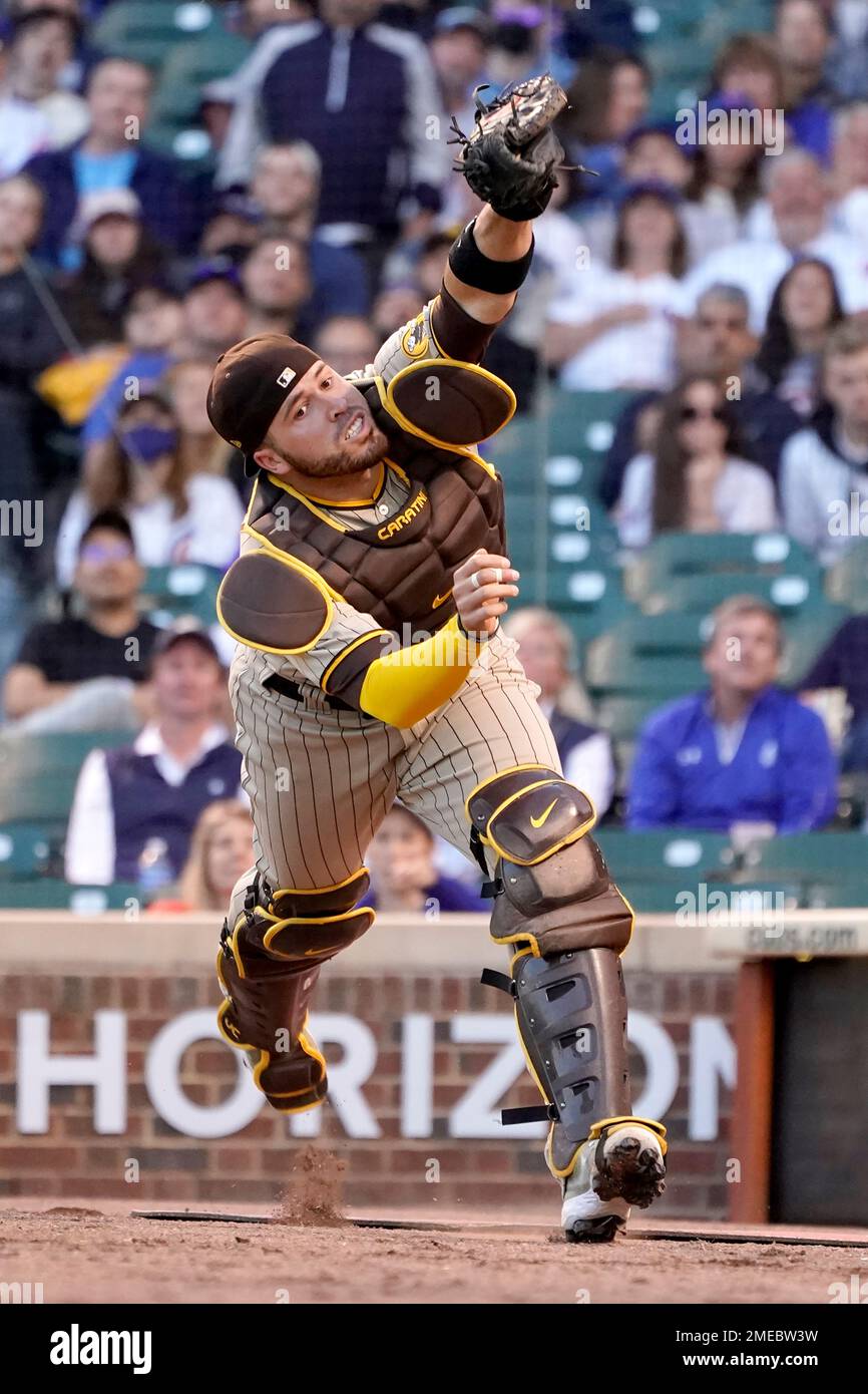 San Diego Padres catcher Victor Caratini throws to first for the out on San  Francisco Giants' LaMonte Wade Jr. during the second inning of a baseball  game Wednesday, Sept. 22, 2021, in